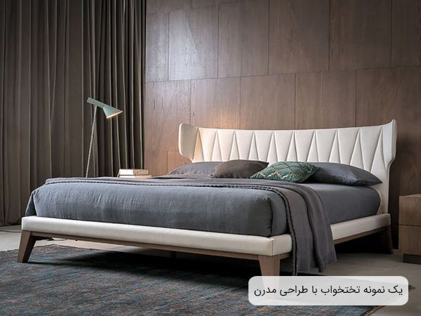 يک عدد تخت خواب دو نفره طراحي شده به سبک امروزی با فريم سفيد رنگ و خوشخواب طوسی